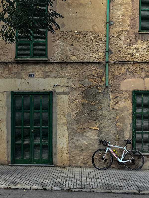 Racebike in front of house wall